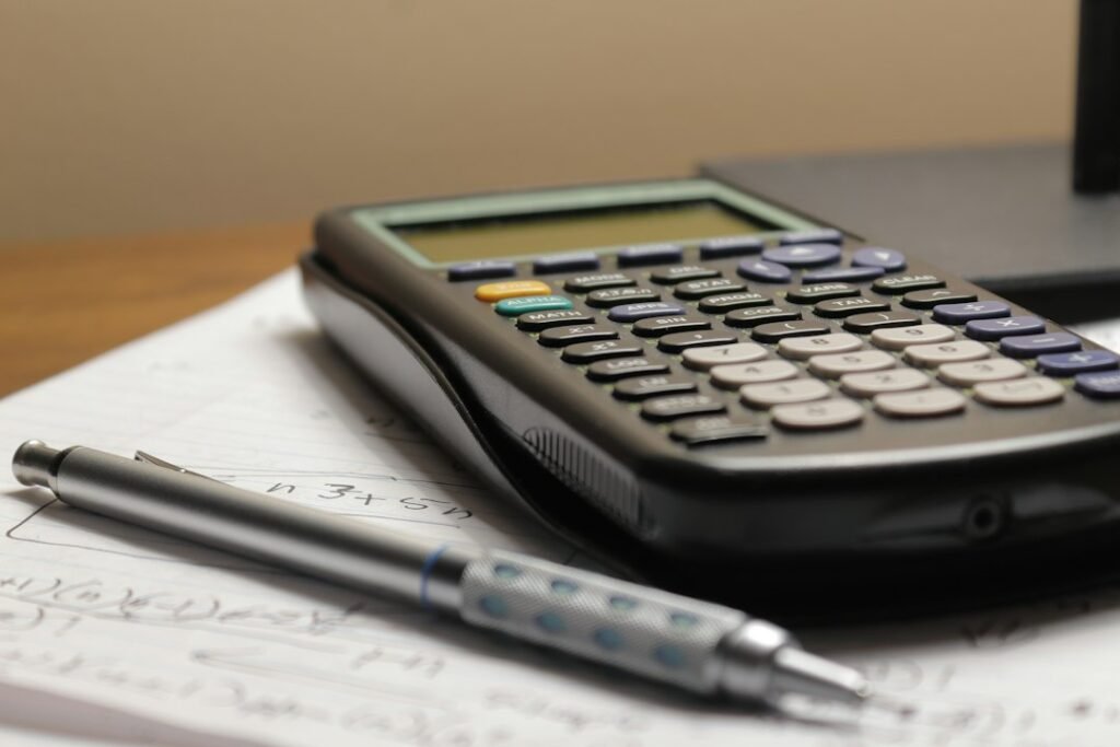 Notebook and calculator used for household money planning