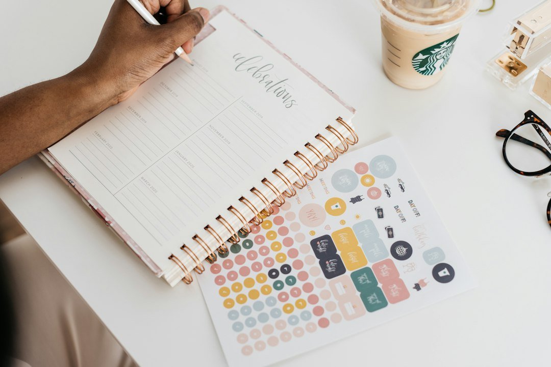 Writing a weekly plan in a notebook
